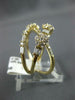 LARGE .99CT DIAMOND 14KT YELLOW GOLD ROUND & BAGUETTE MULTI FLOWER INFINITY RING