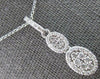 ESTATE .51CT DIAMOND 14KT WHITE GOLD 3D CLUSTER DOUBLE OVAL FUN FLOATING PENDANT