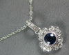 SMALL .40CT DIAMOND & AAA SAPPHIRE 18KT WHITE GOLD FLOWER LOVE FLOATING PENDANT