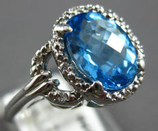 3.34CT DIAMOND & AAA BLUE TOPAZ 14KT WHITE GOLD OVAL & ROUND FUN LOVE KNOT RING