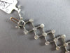 ESTATE .52CT DIAMOND 14K WHITE GOLD BEZEL ETOILE CRISS CROSS FUN TENNIS BRACELET