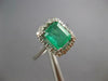 2.16CT DIAMOND & AAA EMERALD 14KT WHITE GOLD 3D ROUND & BAGUETTE ENGAGEMENT RING