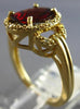 ESTATE 2.64CT DIAMOND & AAA GARNET 14KT YELLOW GOLD OVAL & ROUND LOVE KNOT RING