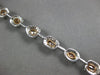 LARGE GIA 6.56CT MULTI COLOR DIAMOND 18KT WHITE & ROSE GOLD HALO TENNIS BRACELET