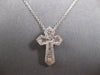 SMALL .52CT DIAMOND 14KT WHITE GOLD 3D ROUND & BAGUETTE CROSS FLOATING PENDANT