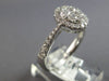 .82CT DIAMOND 18KT WHITE GOLD 3D CLASSIC ROUND CLUSTER HALO OVAL FRIENDSHIP RING