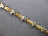 ESTATE 14KT WHITE AND YELLOW GOLD 3D SOLID X LOVE BRACELET