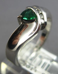 .43CT DIAMOND & AAA EMERALD 14K WHITE GOLD TRILLION & ROUND CRISS CROSS FUN RING