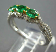 .91CT DIAMOND & AAA EMERALD 18KT 2 TONE GOLD OVAL & ROUND 3 STONE HALO LOVE RING