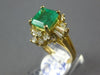 ESTATE 3.20CT DIAMOND & AAA EMERALD 18KT WHITE GOLD ROUND & BAGUETTE FLOWER RING