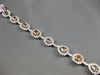 LARGE GIA 6.56CT MULTI COLOR DIAMOND 18KT WHITE & ROSE GOLD HALO TENNIS BRACELET