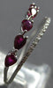 .91CT DIAMOND & AAA RUBY 18KT WHITE GOLD PEAR SHAPE & ROUND CRISS CROSS RING