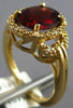 ESTATE 2.64CT DIAMOND & AAA GARNET 14KT YELLOW GOLD OVAL & ROUND LOVE KNOT RING
