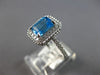 1.44CT DIAMOND & AAA BLUE TOPAZ 14KT WHITE GOLD 3D EMERALD CUT & ROUND HALO RING