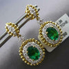 2.06CT DIAMOND & AAA EMERALD 18KT 2 TONE GOLD OVAL & ROUND HALO HANGING EARRINGS