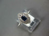 SMALL .31CT DIAMOND & AAA SAPPHIRE 18KT WHITE GOLD EMERALD CUT & ROUND FUN RING