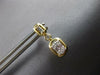 ESTATE .29CT DIAMOND 14KT YELLOW GOLD 3D ROUND & BAGUETTE HANGING EARRINGS