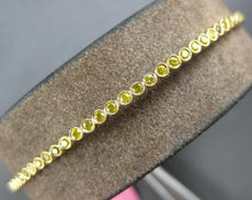 .91CT INTENSE FANCY YELLOW DIAMOND 18KT YELLOW GOLD 2MM FILIGREE BANGLE BRACELET