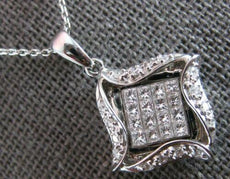 .52CT DIAMOND 18KT WHITE GOLD ROUND & PRINCESS INVISIBLE SQUARE FLOATING PENDANT