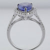 3.66CT DIAMOND & AAA TANZANITE 18KT WHITE GOLD OVAL & ROUND HALO ENGAGEMENT RING