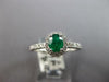 .72CT DIAMOND & AAA EMERALD 18KT WHITE GOLD 3D OVAL & ROUND HALO ENGAGEMENT RING