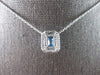 1.34CT DIAMOND & AAA BLUE TOPAZ 14KT WHITE GOLD EMERALD CUT & ROUND HALO PENDANT