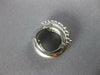 ESTATE .61CT DIAMOND 14KT WHITE GOLD ROUND ETOILE BEZEL 3 STONE HUGGIE EARRINGS