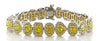 LARGE 9.29CT WHITE & FANCY YELLOW DIAMOND 18KT 2 TONE GOLD HALO TENNIS BRACELET