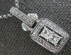 .93CT DIAMOND 18KT WHITE GOLD PRINCESS & ROUND HALO RECTANGULAR FLOATING PENDANT