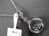 .52CT DIAMOND 14KT WHITE GOLD 3D ROUND & BAGUETTE CLUSTER HALO FLOATING PENDANT