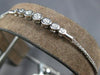 .34CT DIAMOND 18K WHITE GOLD 7 STONE BEZEL GRADUATING ADJUSTABLE TENNIS BRACELET