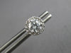 ESTATE .65CT DIAMOND 14KT WHITE GOLD CLASSIC SOLITAIRE HALO FLOWER STUD EARRINGS