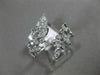 ESTATE WIDE 18KT WHITE GOLD LOVE RING. 3D MULTI LEAF CRISS CROSS DESIGN