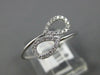 ESTATE .11CT DIAMOND 14KT WHITE GOLD 3D DOUBLE PEAR SHAPE LEAF CRISS CROSS RING