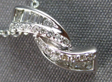 .16CT DIAMOND 14KT WHITE GOLD ROUND & BAGUETTE CRISS CROSS FUN FLOATING PENDANT