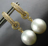 .49CT DIAMOND & SOUTH SEA PEARL 18KT YELLOW GOLD ETOILE HUGGIE HANGING EARRINGS