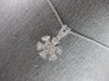 ESTATE .63CT DIAMOND 14KT WHITE GOLD 3D ROUND & BAGUETTE FLOWER FLOATING PENDANT