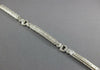 WIDE 4.80CT DIAMOND 18KT WHITE GOLD ROUND & BAGUETTE LOVE KNOT TENNIS BRACELET