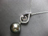 ESTATE LARGE. 15CT DIAMOND & AAA TAHITIAN PEARL 18K WHITE GOLD LOVE KNOT PENDANT
