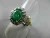 ESTATE 1.82CT ROUND & BAGUETTE DIAMOND & AAA EMERALD 14K TWO TONE GOLD HALO RING