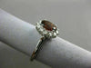 ESTATE 1.45CT DIAMOND & NATURAL GARNET 18KT WHITE GOLD OVAL HALO ENGAGEMENT RING