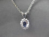 ESTATE .62CTW DIAMOND & AAA TANZANITE 14KT WHITE GOLD OVAL CLUSTER PENDANT