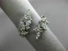 ESTATE WIDE 18KT WHITE GOLD LOVE RING. 3D MULTI LEAF CRISS CROSS DESIGN