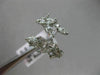 ESTATE WIDE 18KT WHITE GOLD LOVE RING. 3D MULTI LEAF CRISS CROSS DESIGN