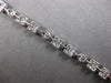 4.22CT DIAMOND 18KT WHITE GOLD ROUND BAGUETTE & MARQUISE SQUARE TENNIS BRACELET