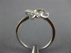 ESTATE .13CT DIAMOND 18KT WHITE GOLD 3D CLASSIC LOVE KNOT FLOWER STAR RING