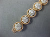 ESTATE WIDE 4.53CT DIAMOND 14KT WHITE & ROSE GOLD CLUSTER FLOWER TENNIS BRACELET