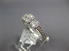 ESTATE .64CT DIAMOND 18KT WHITE GOLD ROUND & BAGUETTE INVISIBLE SQUARE LOVE RING