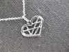 ESTATE .01CT DIAMOND 14K WHITE GOLD ROUND CRISS CROSS HEART FUN FLOATING PENDANT