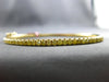 1.1CT INTENSE FANCY YELLOW DIAMOND 18KT YELLOW GOLD SHARED PRONG BANGLE BRACELET